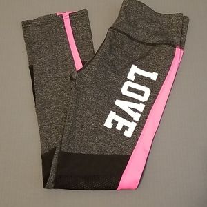 AZL Performance leggings sz Medium (LOVE) logo